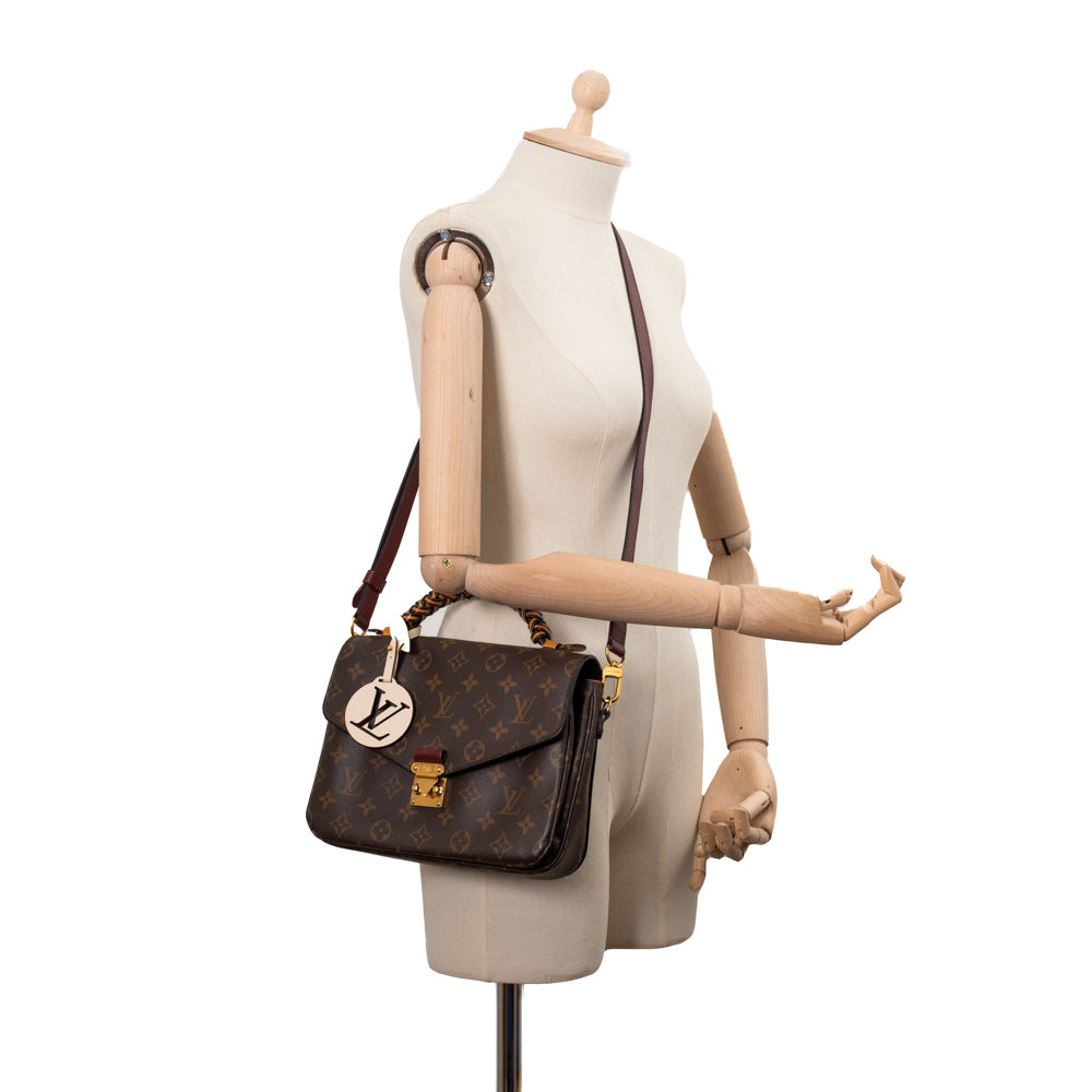 Metis Limited Edition Pochette Bag in brown monogram canvas